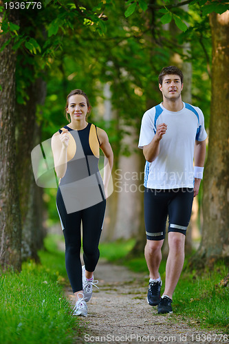 Image of Young couple jogging