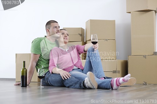 Image of Young couple moving in new home