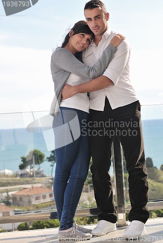 Image of couple relaxing on balcony