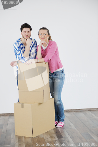 Image of Young couple moving in new house