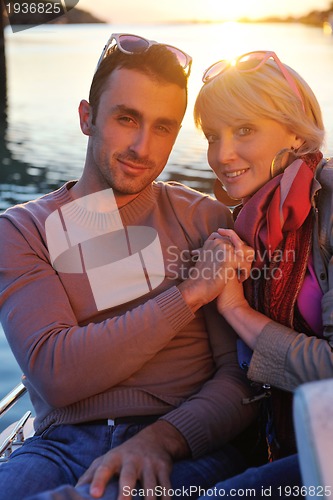 Image of couple in love  have romantic time on boat