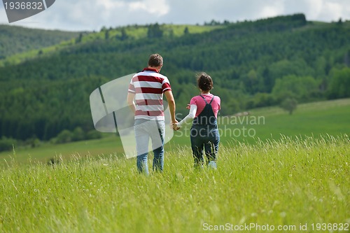 Image of romantic young couple in love together outdoor