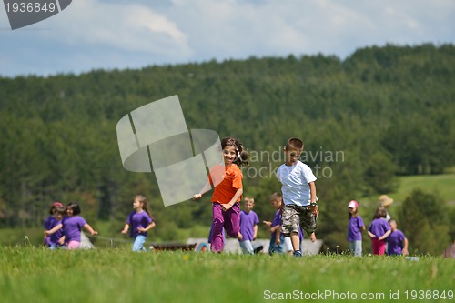 Image of happy kids group  have fun in nature