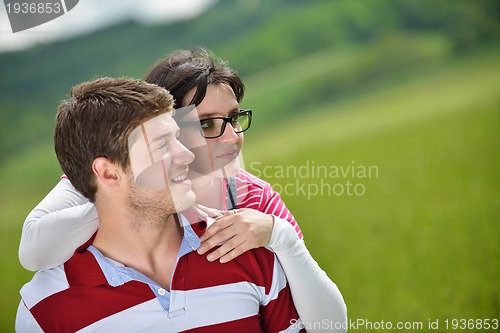 Image of romantic young couple in love together outdoor