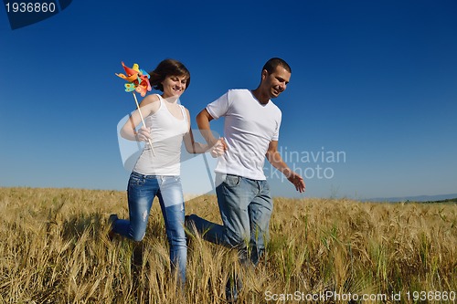 Image of happy couple in wheat field