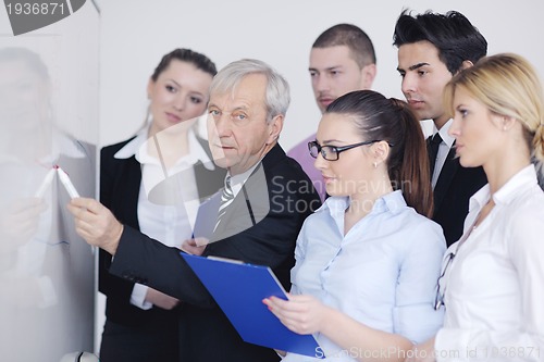 Image of Senior business man giving a presentation