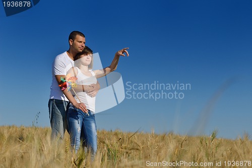 Image of happy couple in wheat field