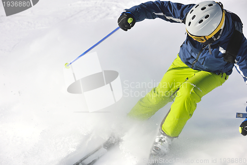 Image of skiing on fresh snow at winter season at beautiful sunny day