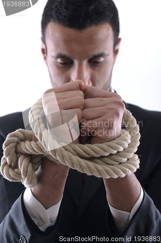 Image of business man with rope isolated on white background