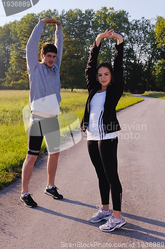 Image of Young couple jogging