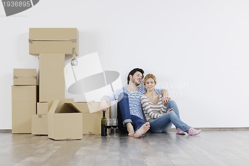 Image of Young couple moving in new home