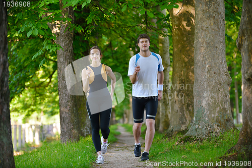 Image of Young couple jogging