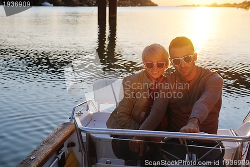 Image of couple in love  have romantic time on boat