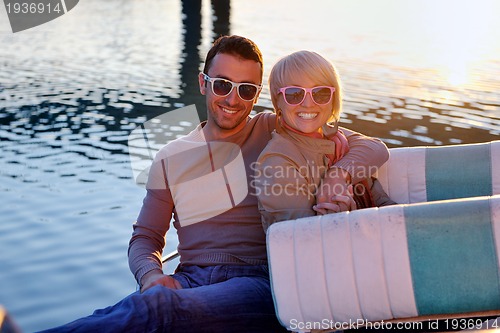 Image of couple in love  have romantic time on boat