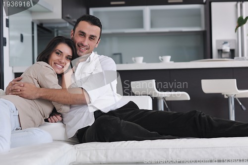 Image of happy young couple relax at home