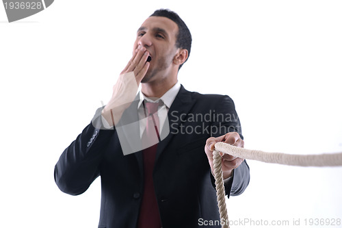 Image of business man with rope isolated on white background