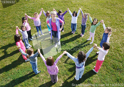 Image of preschool  kids outdoor have fun