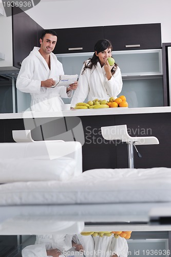 Image of young couple have fun in modern kitchen