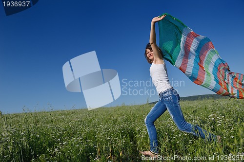 Image of young woman in wheat field at summer