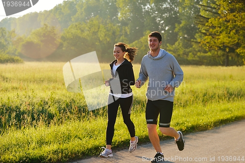 Image of Young couple jogging