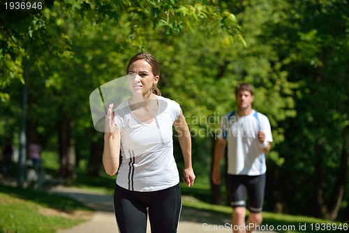 Image of Young couple jogging at morning