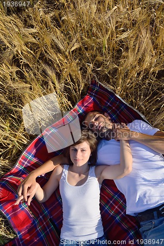 Image of happy couple in wheat field