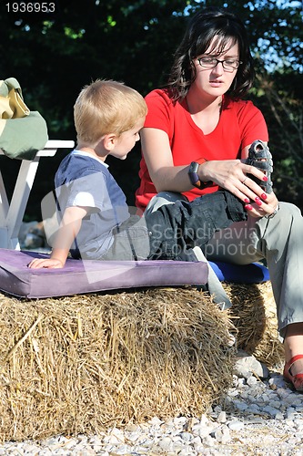 Image of woman and child have fun outdoor