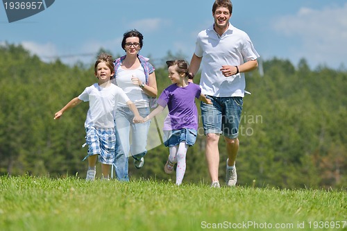 Image of happy young family have fun outdoors