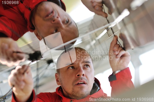 Image of Male solar panel engineer at work place