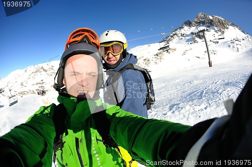 Image of winter portrait of friends at skiing