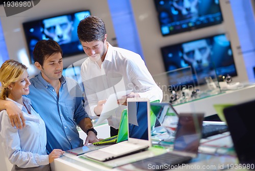 Image of people buy  in consumer electronics store