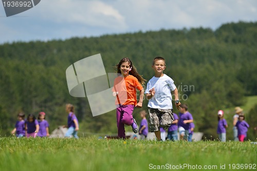 Image of happy kids group  have fun in nature