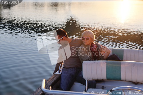 Image of couple in love  have romantic time on boat