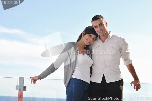 Image of couple relaxing on balcony