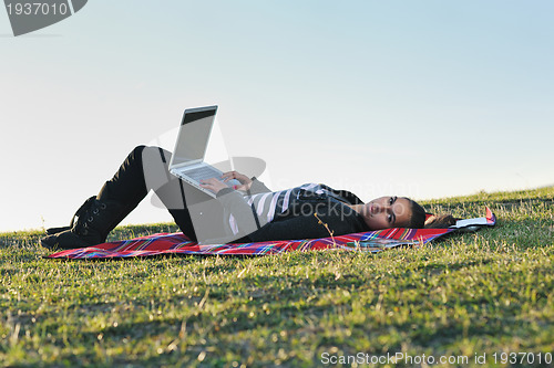Image of young teen girl work on laptop outdoor