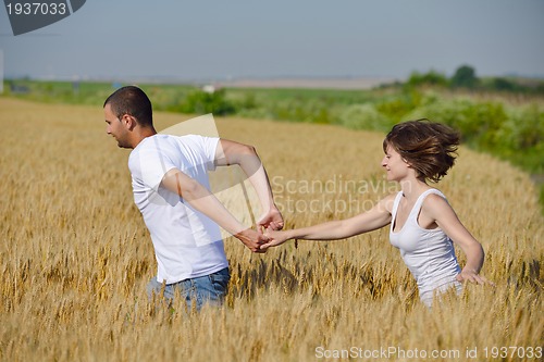 Image of happy couple in wheat field