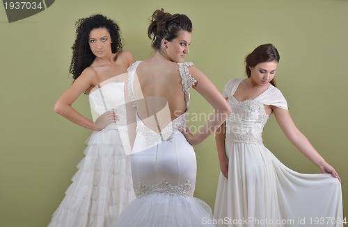 Image of portrait of a three beautiful woman in wedding dress