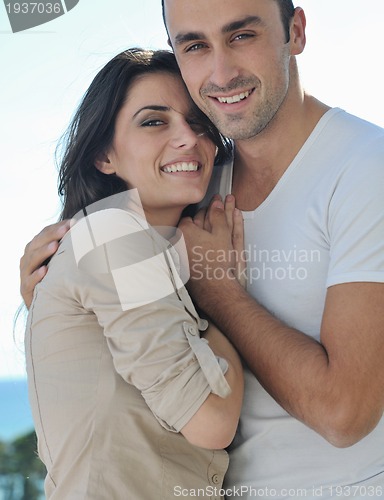 Image of couple relaxing on balcony