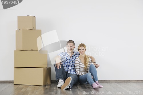 Image of Young couple moving in new home