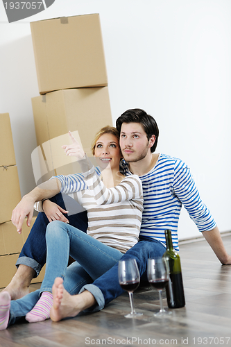 Image of Young couple moving in new house