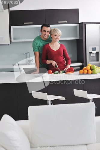 Image of young couple have fun in modern kitchen
