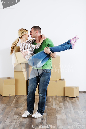 Image of Young couple moving in new house