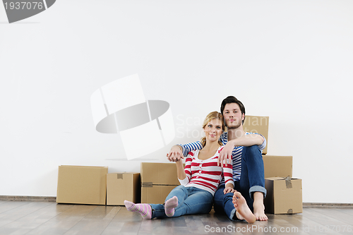 Image of Young couple moving in new house