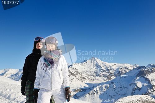 Image of winter portrait of friends at skiing