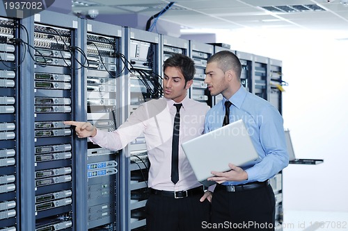 Image of it enineers in network server room