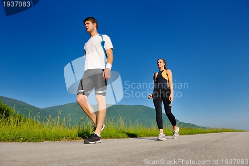 Image of Young couple jogging