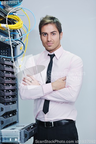 Image of young it engineer in datacenter server room