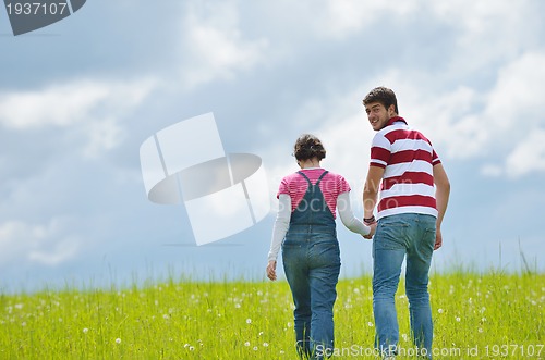 Image of romantic young couple in love together outdoor