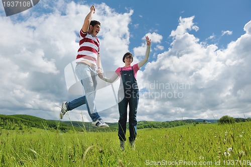 Image of romantic young couple in love together outdoor