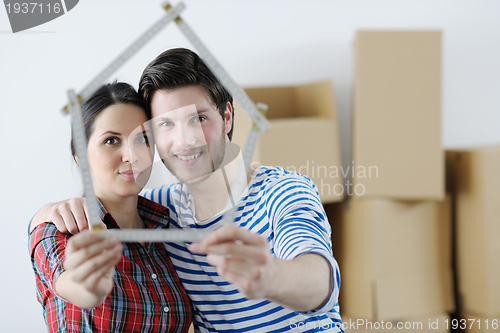 Image of Young couple moving in new house